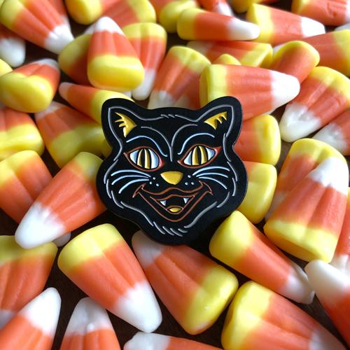 Black cat in retro halloween style as an enamel pin